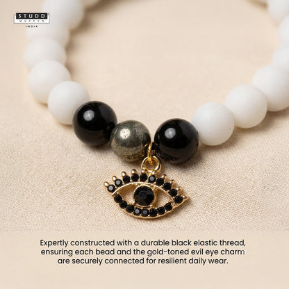 Richie Rich White Bead Black Evil Eye Charm Bracelet