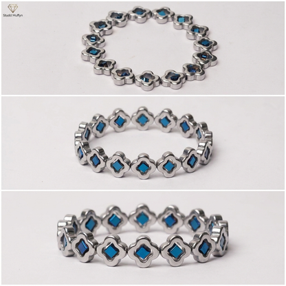 Multi-angle clean catalog collage of the silver blue clover bracelet