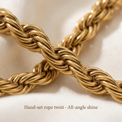 Macro close-up of the twisted gold-toned rope link pattern of the Signature Rope Chain