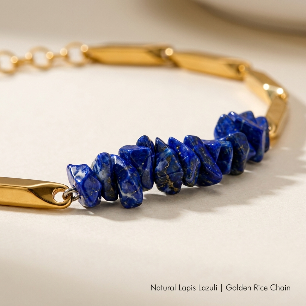 Macro close-up of natural Lapis Lazuli crystal chips and polished golden rice-chain links