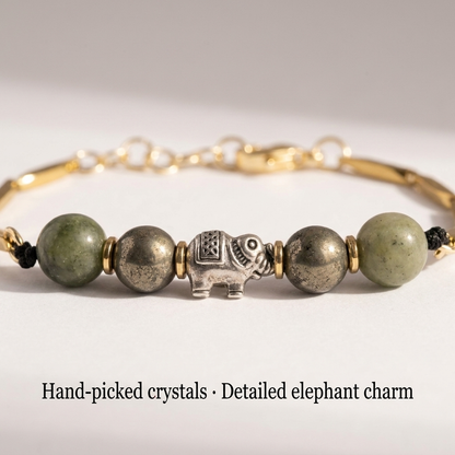 Macro close-up of the silver elephant charm and jade and pyrite crystal beads