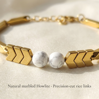 Macro close-up of the chevron rice links and natural Howlite beads of the bracelet