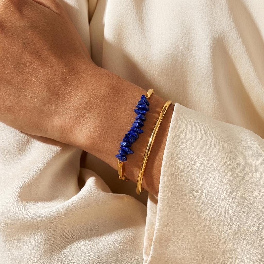 Woman styling the Lapis Lazuli crystal rice chain bracelet with a cream outfit