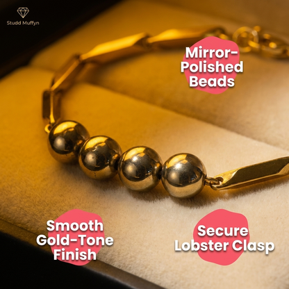 Macro of the polished golden hematite beads and gold links showing finish quality