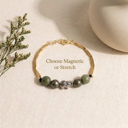 Bracelet styled flat-lay with soft neutral props