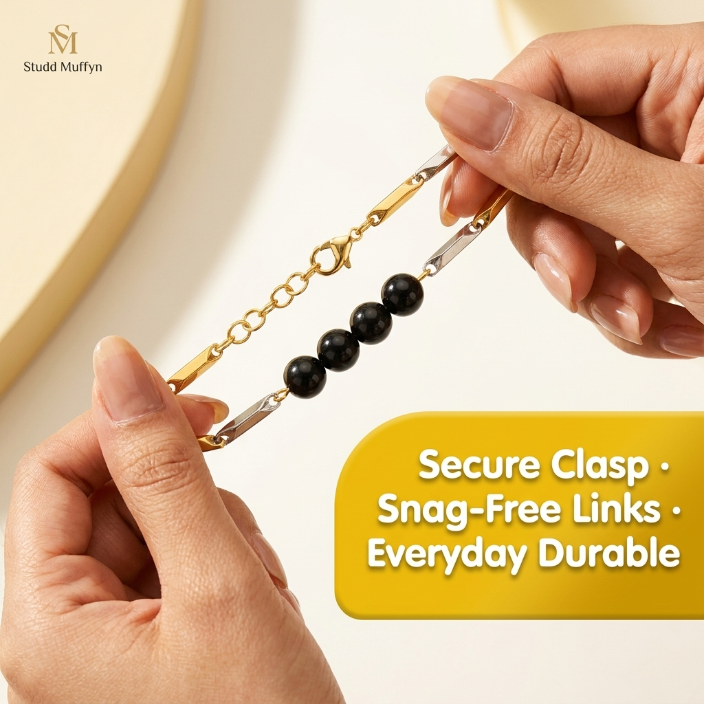 Black Obsidian bracelet held taut between fingers in a secure-clasp durability test