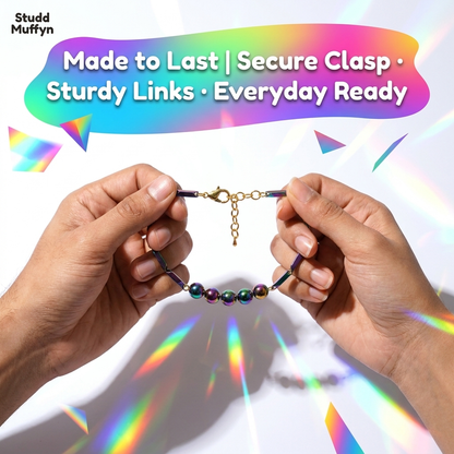 Strength test showing the bracelet clasp and links held taut between fingers