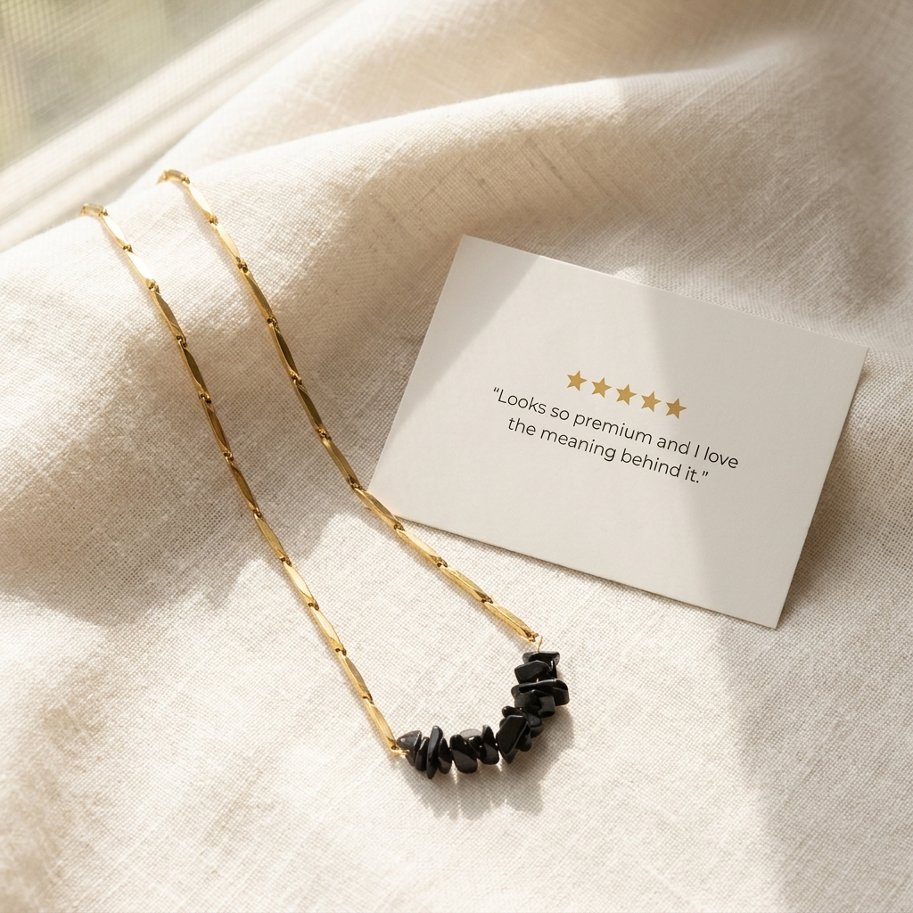 Five-star customer review card beside the Obsidian rice chain necklace