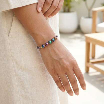 Woman wearing the Prism Hematite Rice Chain Bracelet on her wrist